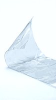 Crumpled transparent plastic bag isolated on white background, suitable for design, packaging mockups, environmental awareness campaigns, and commercial applications.