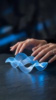 Female hands protecting glowing blue digital wave hologram on dark surface representing data protection, cybersecurity and technology innovation concepts.