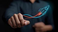 Glowing neon rocket icon with red trail floating above businessman finger against dark background, representing business growth and startup concept.