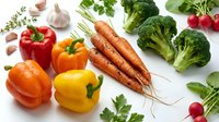 Fresh organic vegetables including colorful bell peppers, carrots, broccoli, radishes and herbs arranged on white background for healthy cooking and nutrition.