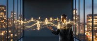 Young professional woman in business suit connecting glowing network nodes with hands in modern office overlooking city skyline at night.
