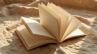 Open book with blank pages on soft fabric in warm natural light creating peaceful reading atmosphere for education and literature concepts.