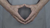 Elderly hands forming heart shape gesture showing love care and compassion in healthcare senior support concept for medical wellness programs.