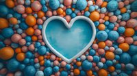 Heart shaped frame surrounded by vibrant orange and turquoise spheres creating romantic composition with contrasting colors and textures for greeting cards and love themes.