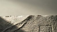 Desert sand dunes with dramatic shadows and textures creating natural landscape patterns for environmental and travel concepts.