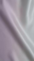 Smooth lavender purple silk fabric with elegant flowing folds and soft metallic sheen creating luxurious textile background for fashion and interior design projects.