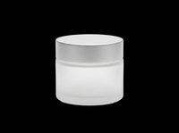 Frosted glass cosmetic jar with silver metallic lid, isolated on transparent background. Ready for beauty product packaging design, e-commerce mockups, skincare branding, print-on-demand labels, and digital marketing materials.