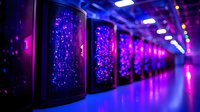 Futuristic data center corridor with glowing server racks illuminated by vibrant purple and blue LED lights creating dramatic perspective along reflective floor.