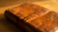 Homemade chocolate brownies with rich fudgy texture and cracked surface on wooden cutting board ready for serving at bakery or dessert table.