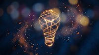 Glowing wireframe light bulb with golden particles and bokeh on dark blue background, representing innovation, creativity, and energy efficiency concepts.