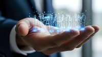 Businessman holding holographic digital people icons in cupped hands representing human resources management and team leadership concepts.