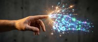 Human hand reaching toward glowing digital network with sparks and light effects representing artificial intelligence and technology connection.