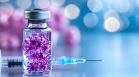 Medical vial with purple crystalline substance and syringe on bokeh background for pharmaceutical research and healthcare concepts.