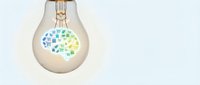 Light bulb with colorful geometric brain pattern inside representing creativity, innovation and intelligent thinking for business concepts.