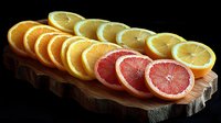 Fresh orange and grapefruit slices arranged in row on rustic wooden board against black background, vibrant citrus fruit composition for healthy eating concept.