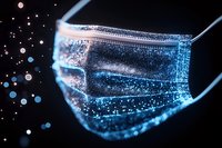 Medical face mask with glowing blue particles and bokeh effects against dark background, representing healthcare protection and virus prevention in modern medicine.