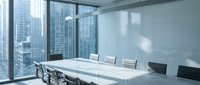 Modern corporate boardroom with white conference table and black chairs overlooking city skyline through floor-to-ceiling windows for business meetings.