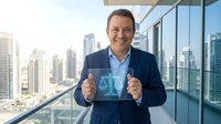 Middle-aged Caucasian businessman in navy suit holding transparent digital scale hologram in modern office with city skyline background for business concepts.