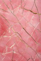 Pink marble texture with gold veining creates luxurious natural stone pattern. Elegant abstract background for interior design and luxury packaging.