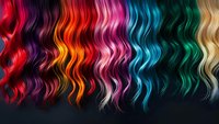Vibrant rainbow colored wavy hair strands arranged in spectrum order against dark background showcasing different hair dye colors and styling possibilities for beauty industry.