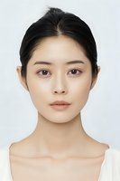 Young Asian woman with natural makeup and clear skin on white background, showcasing minimalist beauty and clean skincare aesthetic for cosmetic advertising.