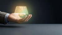 Businessman hand holding glowing solar panel with green energy light effect on dark background for renewable technology and sustainability concepts.