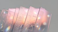 Translucent glass panels with warm golden light and bokeh effects creating an abstract, modern composition suitable for backgrounds and design projects.