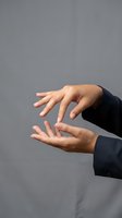 Business professional hands in protective gesture showing care and support concept for teamwork and collaboration in corporate environment.