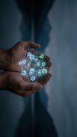 Hand holding glowing molecular network structure with connected nodes, representing innovation, technology, science, and digital transformation in business and research applications.