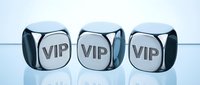 Three metallic dice with VIP text on reflective surface representing exclusive membership, luxury services, premium access and elite status concepts.
