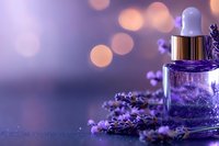 Glass dropper bottle with purple liquid essence surrounded by fresh lavender sprigs on blurred bokeh background, creating magical spa atmosphere.