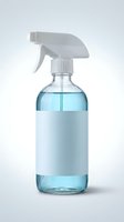 Glass spray bottle with blue liquid and blank white label, isolated on light background, mockup for cleaning product branding design.