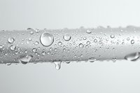 Water droplets on transparent glass surface creating natural condensation pattern with crystal clear beads and moisture for fresh clean design concepts.