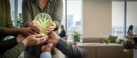 Diverse group of people holding fresh cabbage together in office, promoting healthy eating, teamwork, nutrition awareness, and sustainable food choices at workplace.