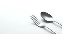 Elegant silver fork and spoon cutlery set on clean white background for kitchen dining and restaurant design projects.
