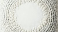 Overhead view of coiled white rope arranged in concentric circles on neutral background, isolated for design use on merchandise, packaging, and promotional materials.