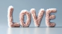 Fluffy pink text spelling LOVE made from soft furry material on light background. Creative typography design for romantic greeting cards and valentines.