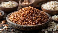 Coriander seeds in wooden bowl with various spices and legumes arranged on rustic surface for culinary cooking and seasoning applications.