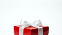 Red gift box with white ribbon bow on white background, isolated for holiday celebrations, Christmas presents, special occasions, and festive design projects.