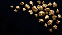 Golden nuggets scattered on dark background representing precious metal mining wealth and natural treasure discovery for investment concepts.