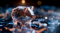 Transparent piggy bank filled with coins scattered around on reflective surface with bokeh lights in background, representing savings, financial planning, and wealth accumulation for banking and investment concepts.