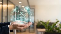 Professional businessman holding holographic digital network sphere with connected icons representing modern technology and business connectivity solutions.