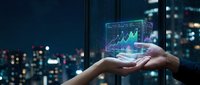 Businessman holding holographic financial chart with growth data analytics in modern city office at night for investment and trading technology concepts.