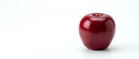 Red apple with glossy finish isolated on white background, suitable for food, health, nutrition, and wellness design projects.