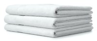 Stack of three white fluffy cotton bath towels neatly folded and piled on white background, isolated for spa, hotel, and bathroom design use.