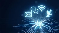 Digital communication network with glowing icons including email, chat, wifi and satellite symbols radiating from central light source on dark blue background.