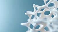 Macro view of white porous bone structure against blue background showing organic cellular pattern and natural architecture design, medical science concept.