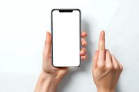 Female hands holding modern smartphone with blank white screen, one finger pointing at display on light background. Perfect for app or website mockup.