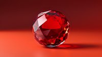 Faceted red crystal sphere with brilliant reflections and shadows on red background, luxury gemstone concept showcasing precision cut and clarity.