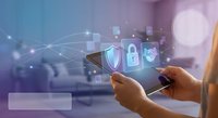 Mobile cybersecurity concept with hands holding smartphone displaying digital security icons including shield, lock and protection symbols in modern tech environment.